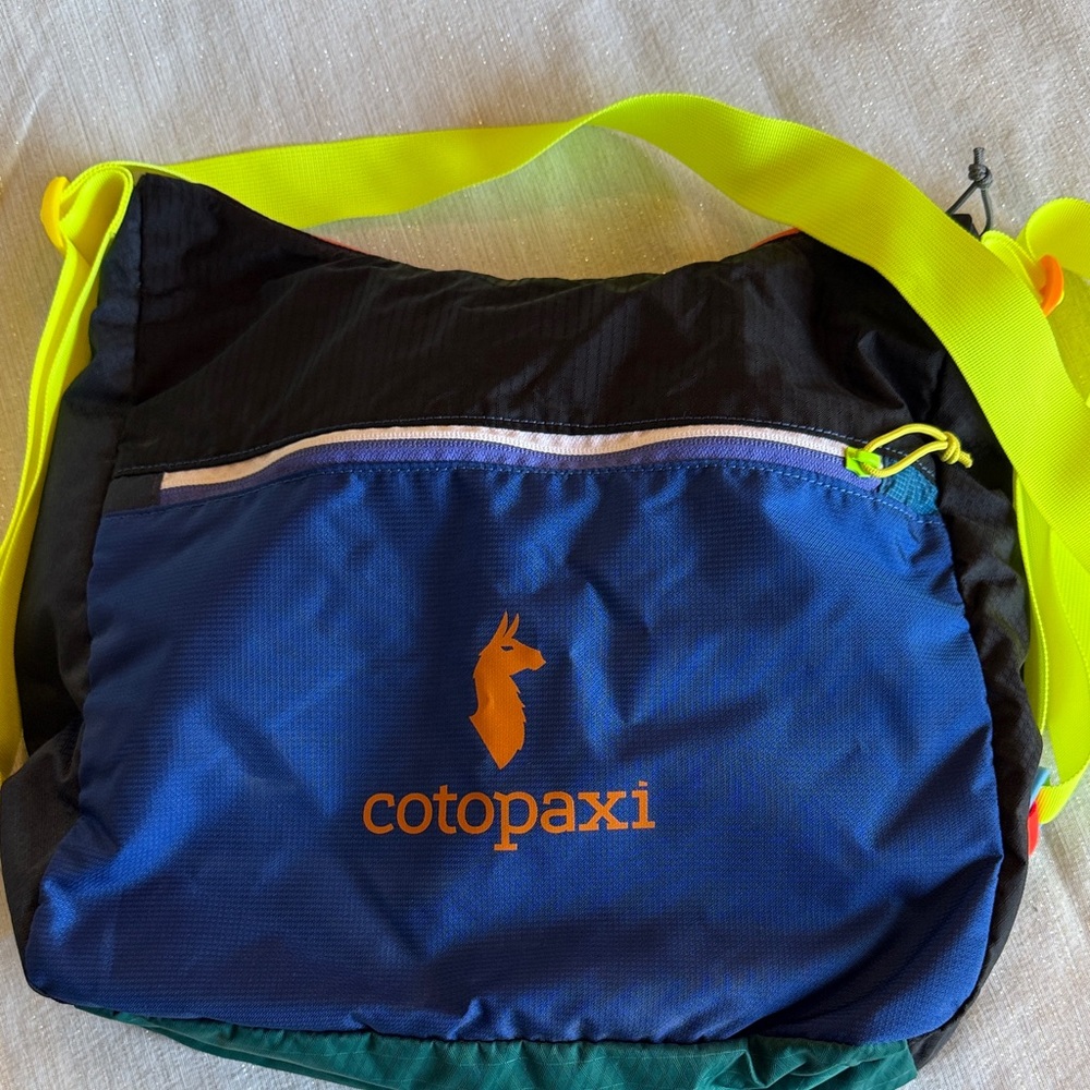 Cotopaxi Blue and Black Messenger Bag with Neon Yellow Strap